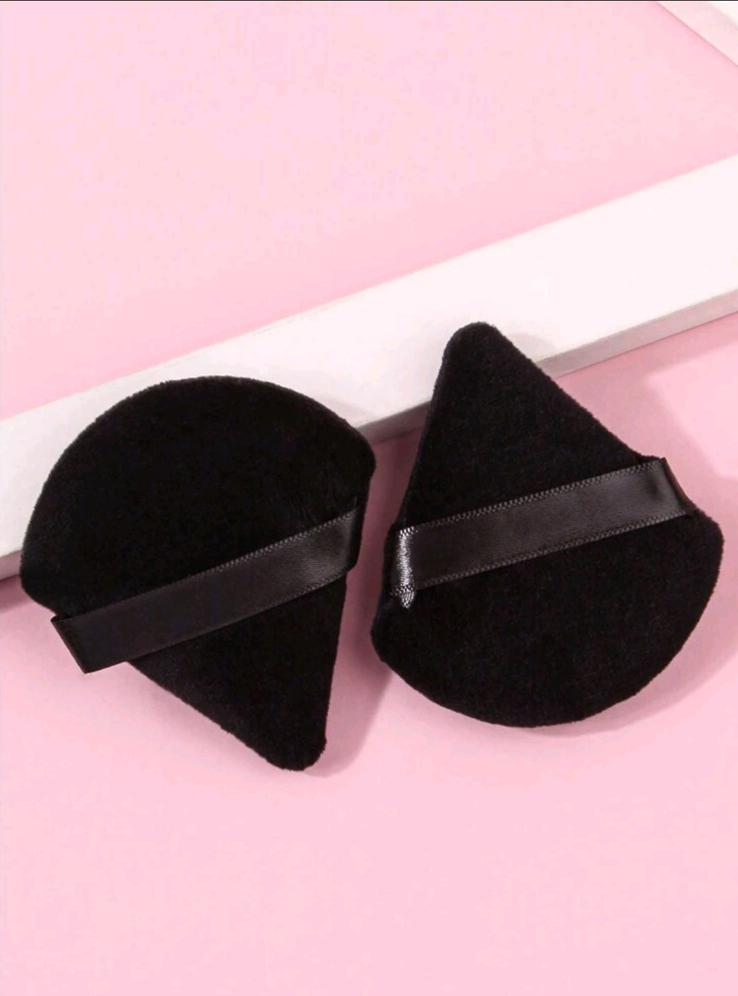 2 borlas de maquillaje
